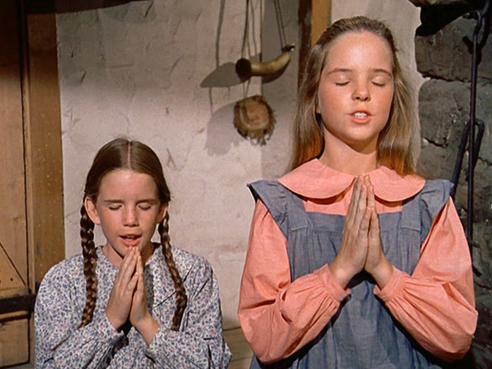 Laura and Mary say their prayers