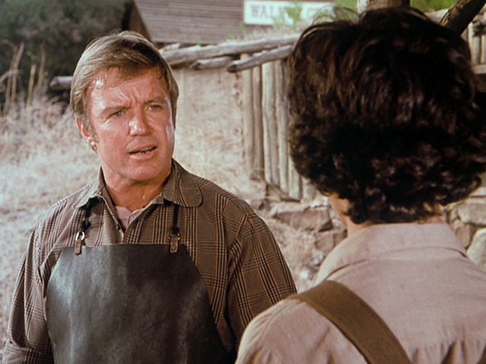 Albert with the local blacksmith, Mr. Hartwig, played by Richard Jaeckel