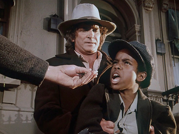 Street kid B. J. is confronted with John Jr.'s watch