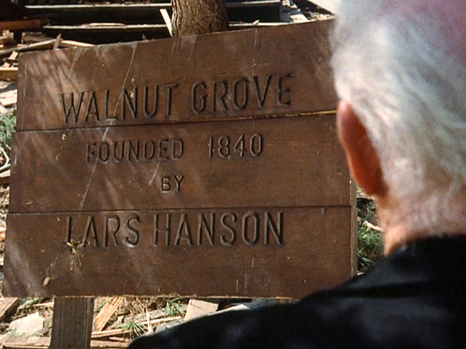 Reverend Alden takes a last look at the Walnut Grove sign